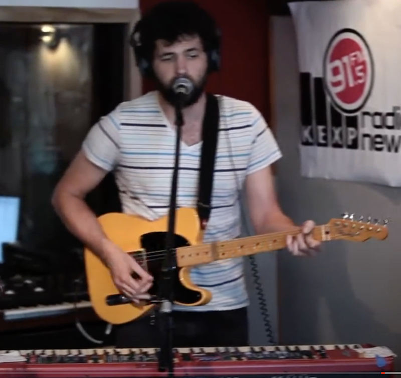 david morrin playing guitar in a studio