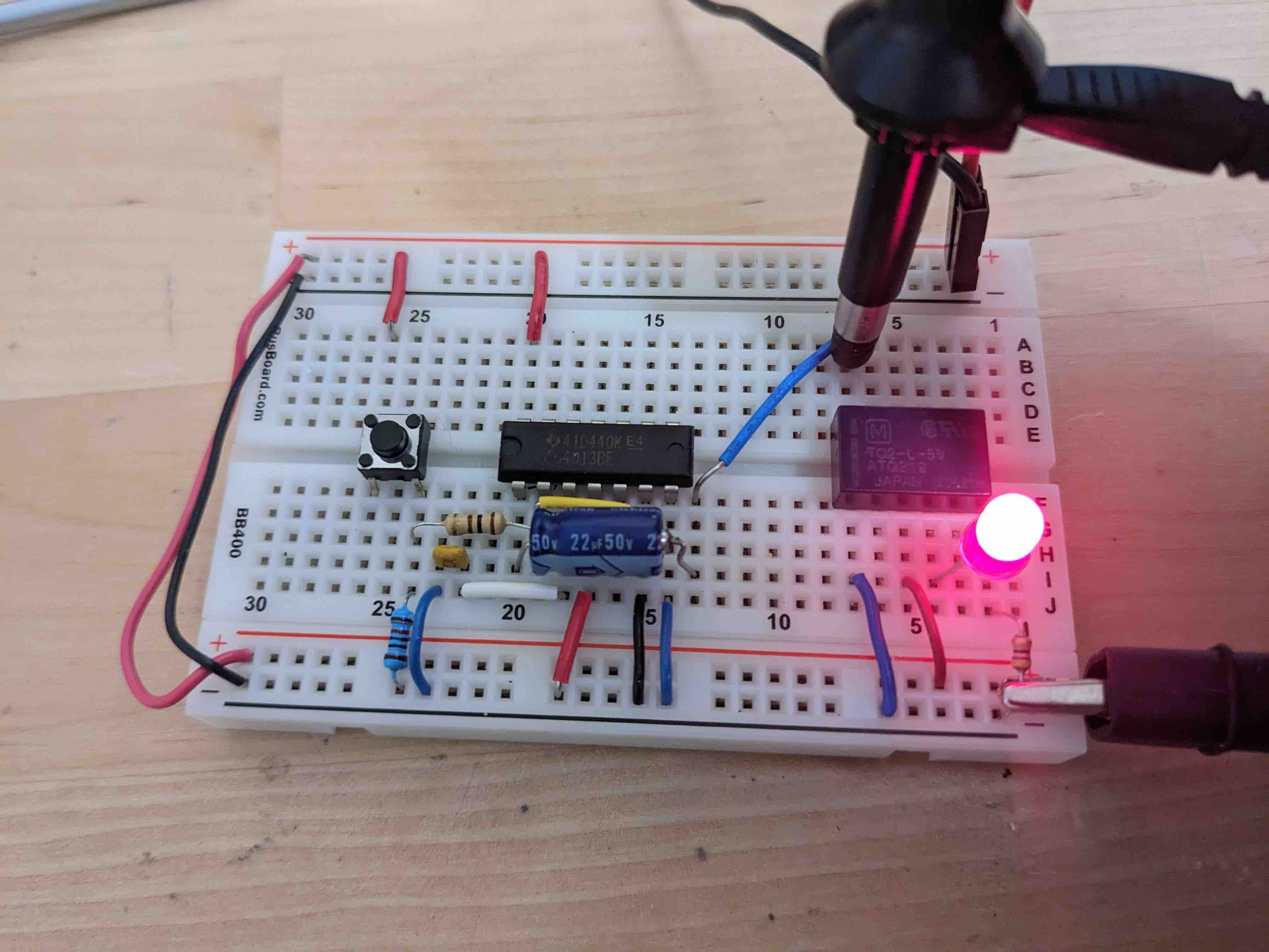 Breadboard with CD4013 and TQ2 relay.